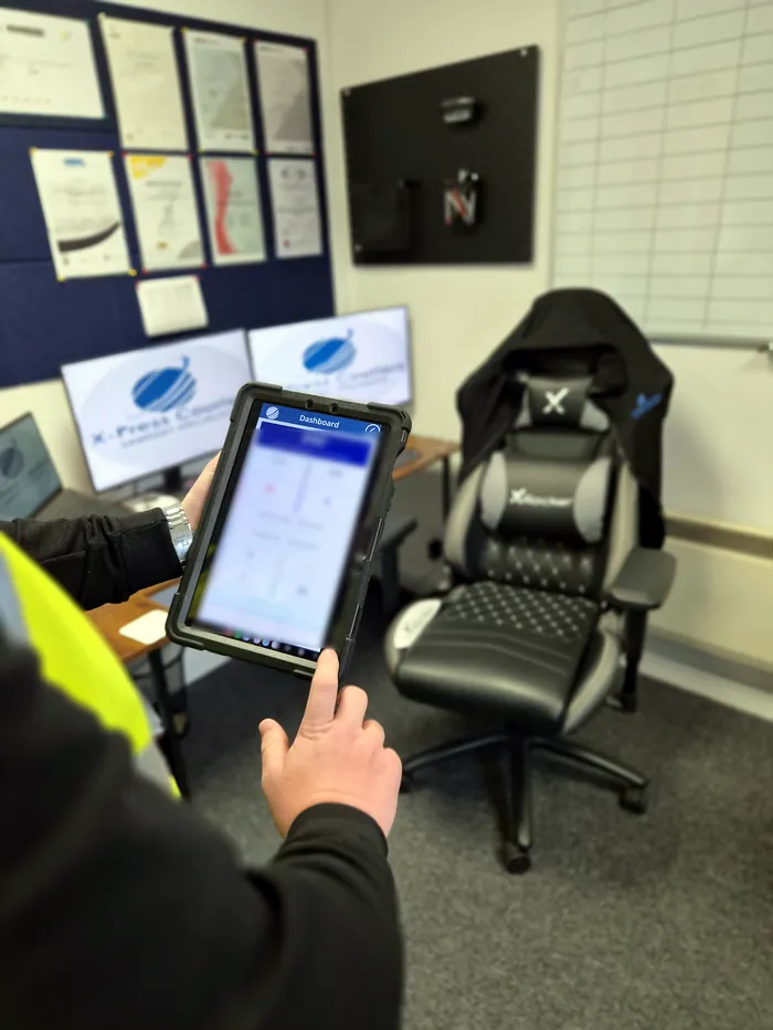 The X-Press stock system dashboard open on a tablet