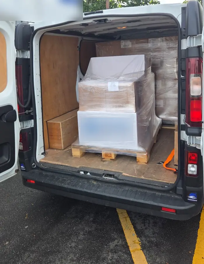 A wrapped pallet loaded and secured in an X-Press Couriers van