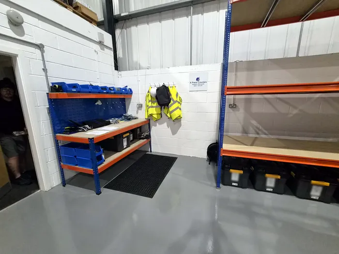 Hi-vis and PPE ready at the kit bench in the X-Press Couriers warehouse