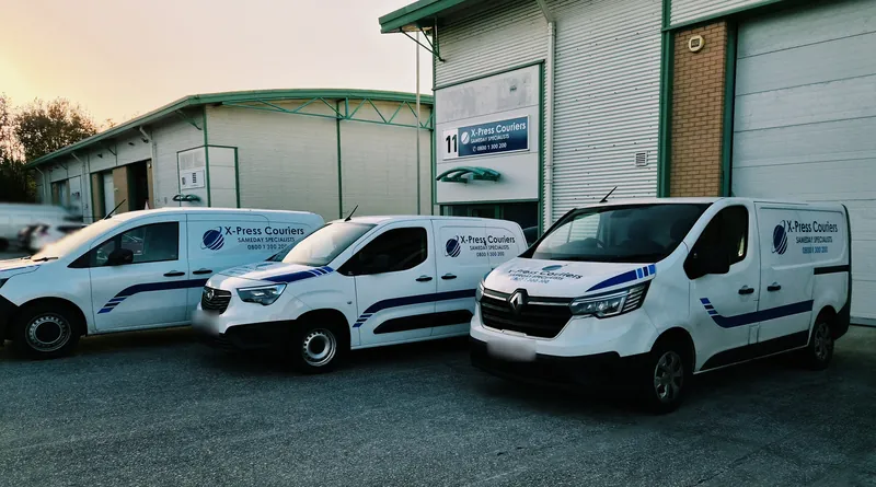 X-Press Couriers vans in Sameday Specialists livery lined up outside the depot at Unit 11, St Helens